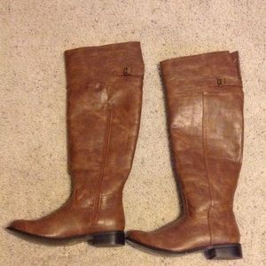 Knee high brown boots.